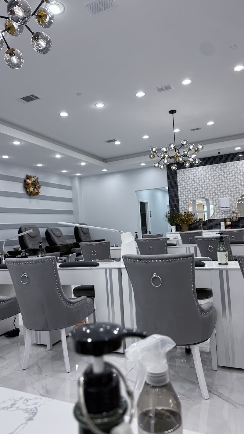 Ten Ten Nails Spa interior showing modern chairs and crystal chandeliers